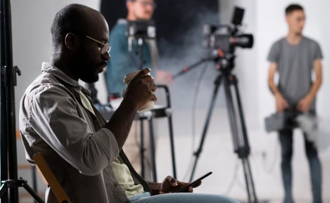 camera and camera man behind the set